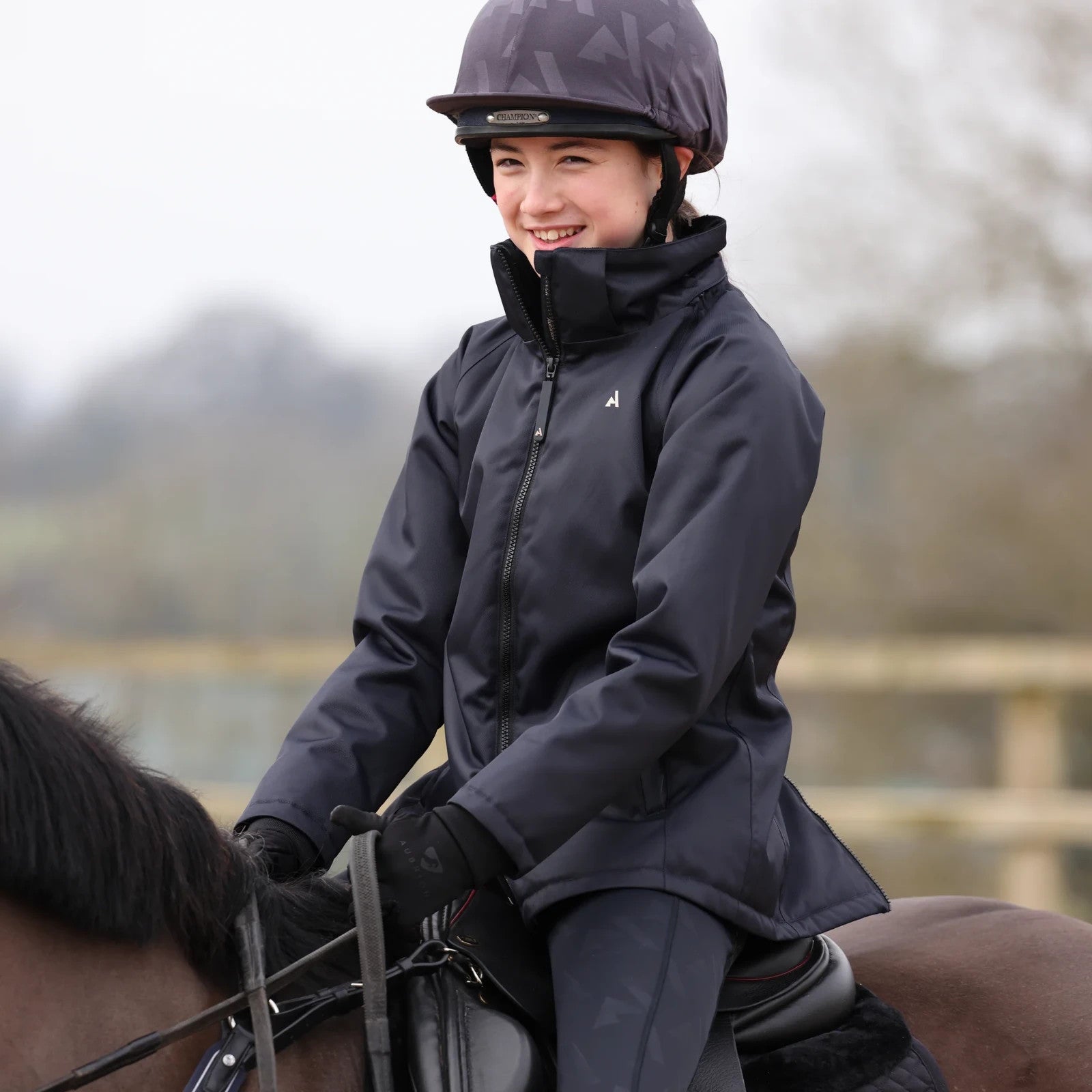 Picture of Shires Aubrion React Mid Length Coat - Young Rider, Waterproof, Detachable Hood,